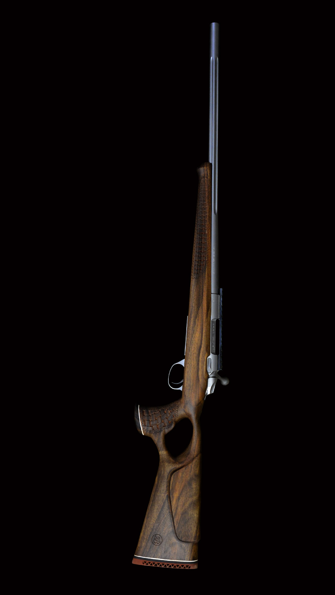 Luxury wood checkering and hand engraved oil finished rifle stock details